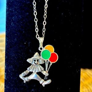 Sterling silver clown necklace with silver chain.